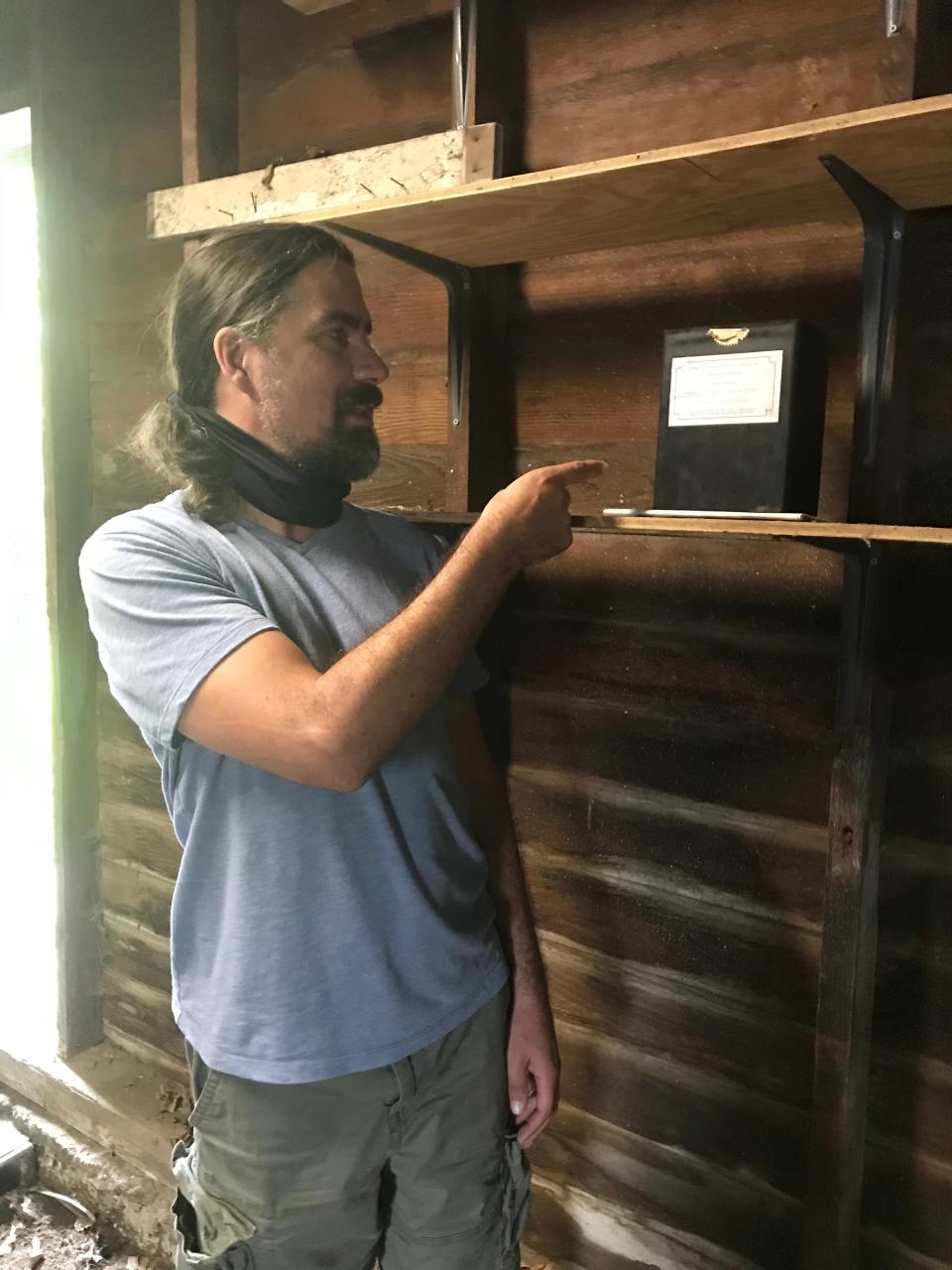 Erik Flail of Langhorne points to the remains of Richard J. Wright,  Flail and his family are hoping someone who knew Wright, who died in 1997, will come forward to claim the abandoned remains.