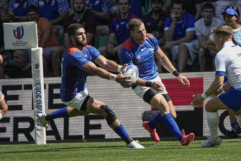 Namibia's Divan Rossouw takes the ball during the Rugby World Cup Pool A match between Italy and Namibia at the Geoffroy Guichard stadium in Saint-Etienne, central France, Saturday, Sept. 9, 2023. (AP Photo/Laurent Cipriani)