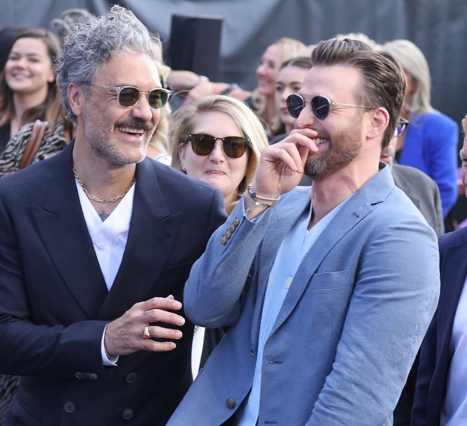 Taika Waititi and Chris Evans share a joke as they attend the "Lightyear" UK Premiere at Cineworld Leicester Square