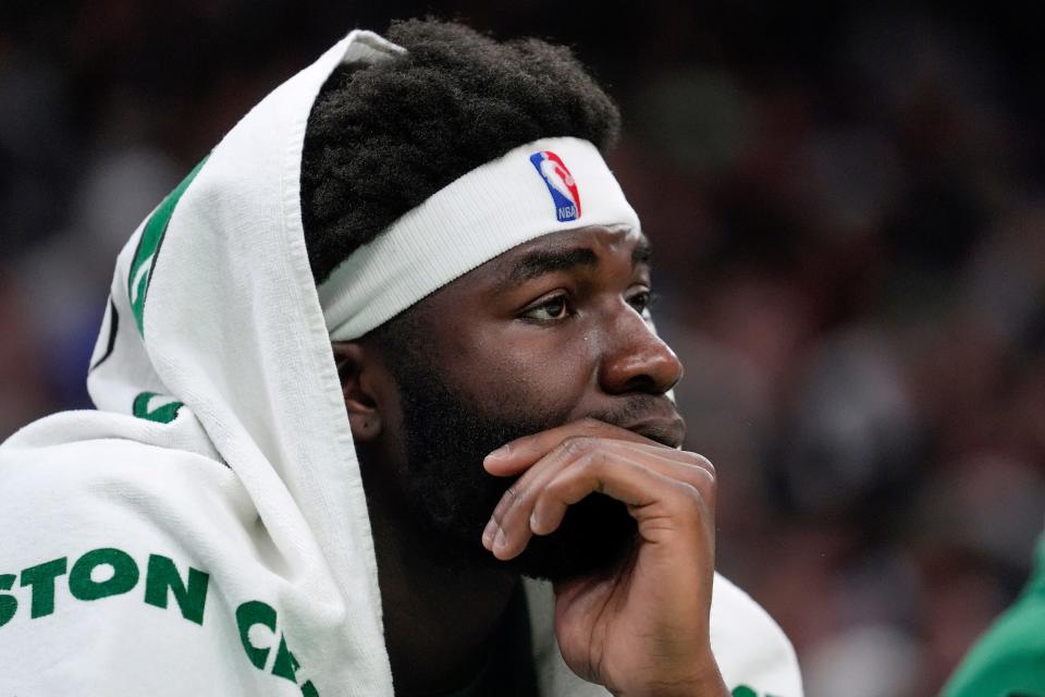 Boston Celtics center Neemias Queta watches from the bench as the Celtics trail the Los Angeles Lakers in the second half of an NBA basketball game, Thursday, Feb. 1, 2024, in Boston. (AP Photo/Steven Senne)