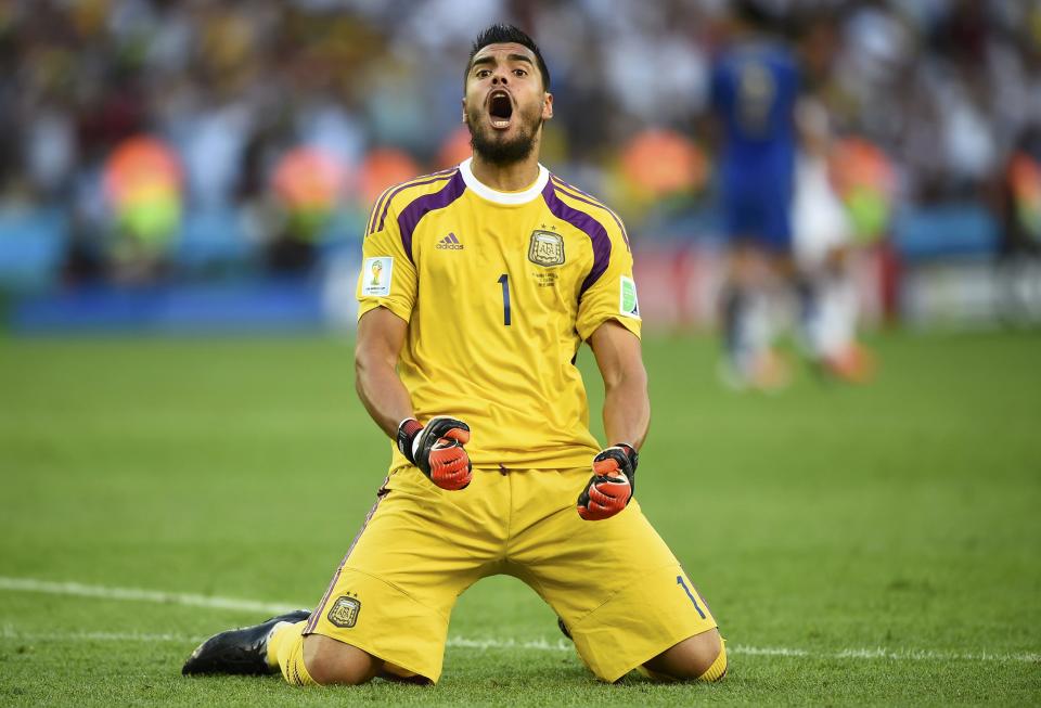 Argentina's goalkeeper Sergio Romero reacts to an offside goal by teammate Gonzalo Higuain (not pictured) during their 2014 World Cup final against Germany at the Maracana stadium in Rio de Janeiro July 13, 2014. REUTERS/Dylan Martinez (BRAZIL - Tags: SOCCER SPORT WORLD CUP)