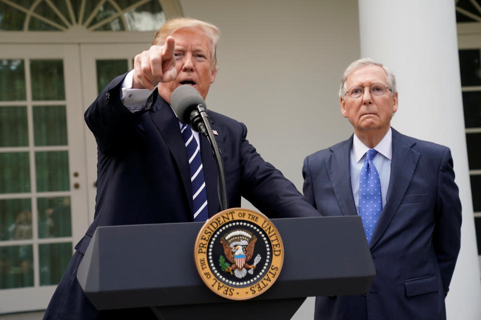 U.S. President Donald Trump speaks to the media with U.S. Senate Majority Leader Mitch McConnell at his side in the Rose Garden of the White House in Washington