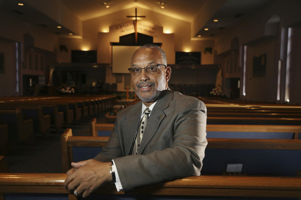 CORRECTS NAME OF CHURCH TO FIRST INSTITUTIONAL BAPTIST CHURCH FROM INSTITUTIONAL BAPTIST CHURCH In this Tuesday, July 30, 2019 photo, Civil Rights leader Rev. Dr. Warren H. Stewart Sr. sits in the sanctuary of his church, the First Institutional Baptist Church, in Phoenix. Phoenix’s past segregation has been in focus after this summer’s national outrage over a videotaped encounter of police pointing guns and cursing at a black family. “That has long been a reality for African Americans, to not be treated fairly by the police,” said Stewart. “Segregation has been outlawed, but the remnants of systemic racism and discrimination remain.” (AP Photo/Ross D. Franklin)