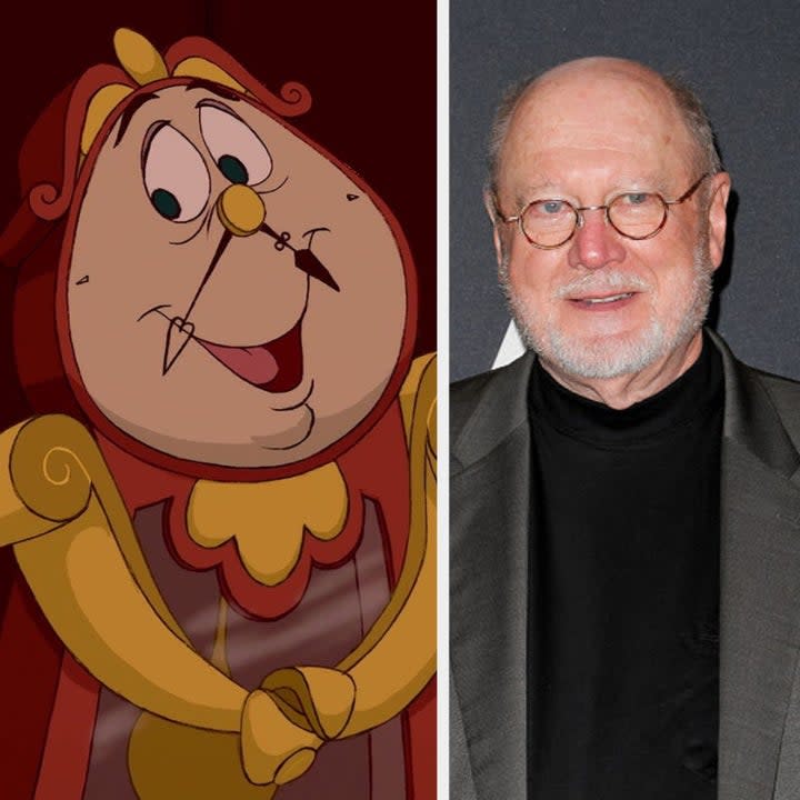 Cogsworth the clock from the original Beauty and the Beast smiling. David Ogden Stiers standing and smiling