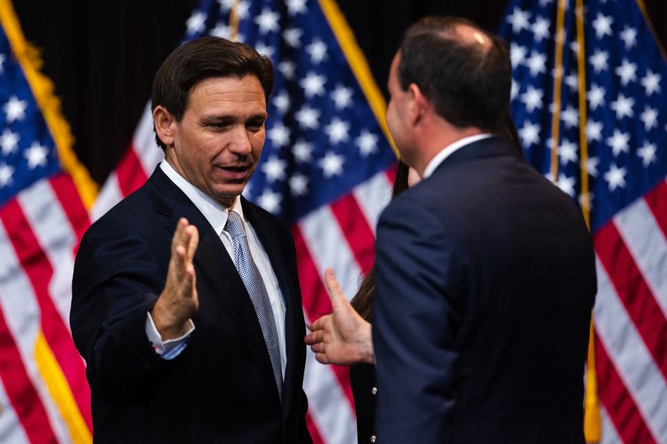 Florida Gov. Ron DeSantis prepares to shake Sen. Mike Lee’s hand during the Utah Republican Party Organizing Convention at Utah Valley University in Orem on Saturday, April 22, 2023. | Ryan Sun, Deseret News