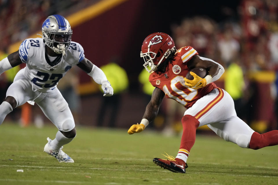 Kansas City Chiefs running back Isiah Pacheco (10) runs with the ball as Detroit Lions cornerback Jerry Jacobs (23) defends during the second half of an NFL football game Thursday, Sept. 7, 2023, in Kansas City, Mo. (AP Photo/Charlie Riedel)