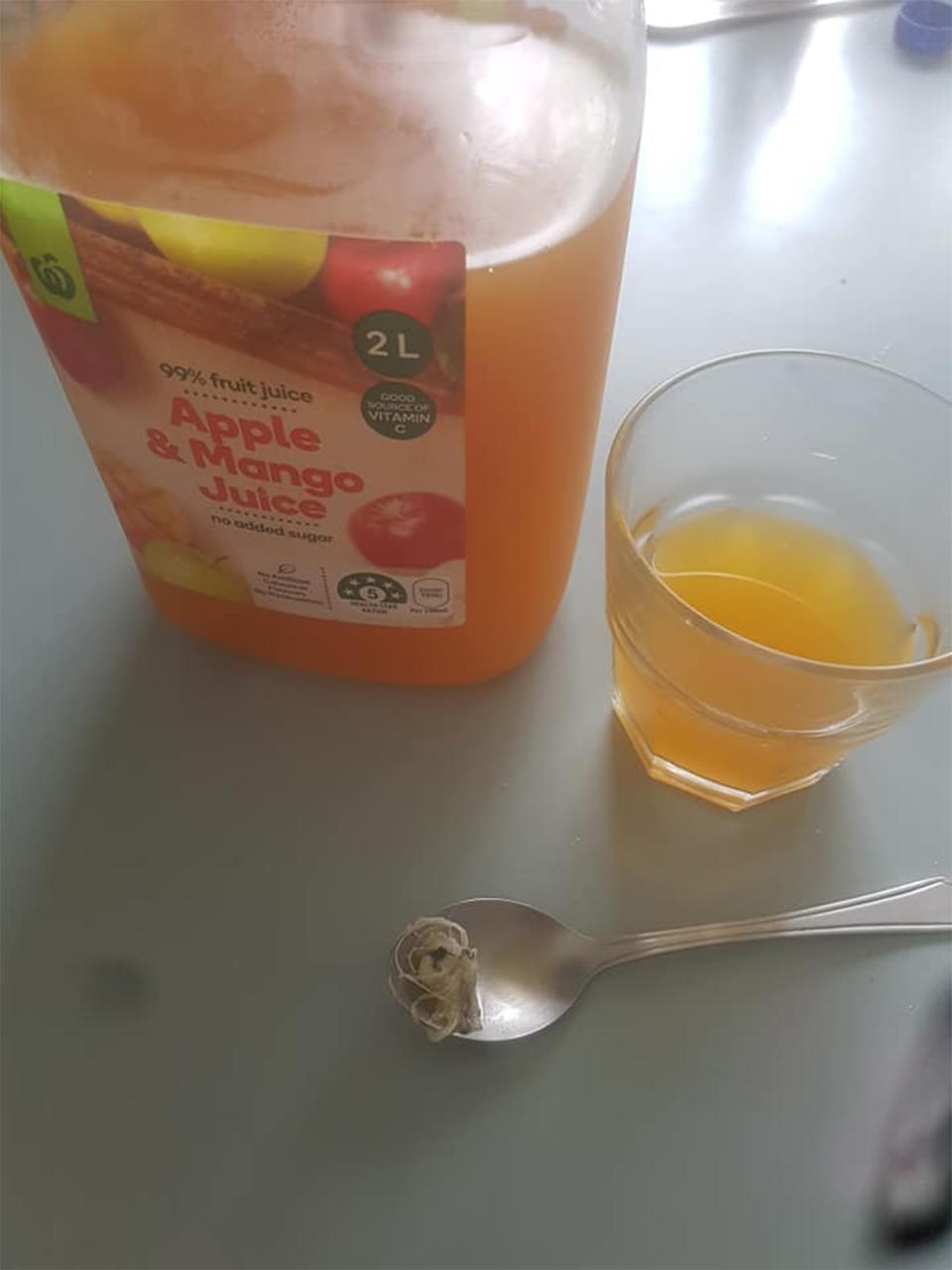 Food contamination: Cami Cole posted an image of the strange object next to the juice bottle. 