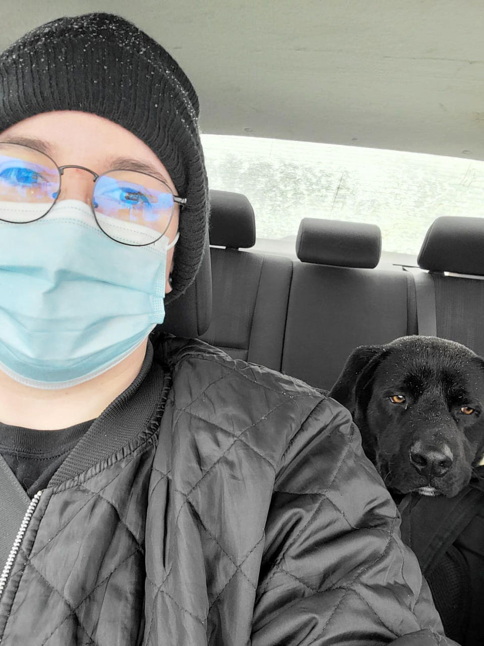 Image: Kristin Salinas and Taco in her car after she found him wandering the street (Courtesy of Kristin Salinas-Labrador)