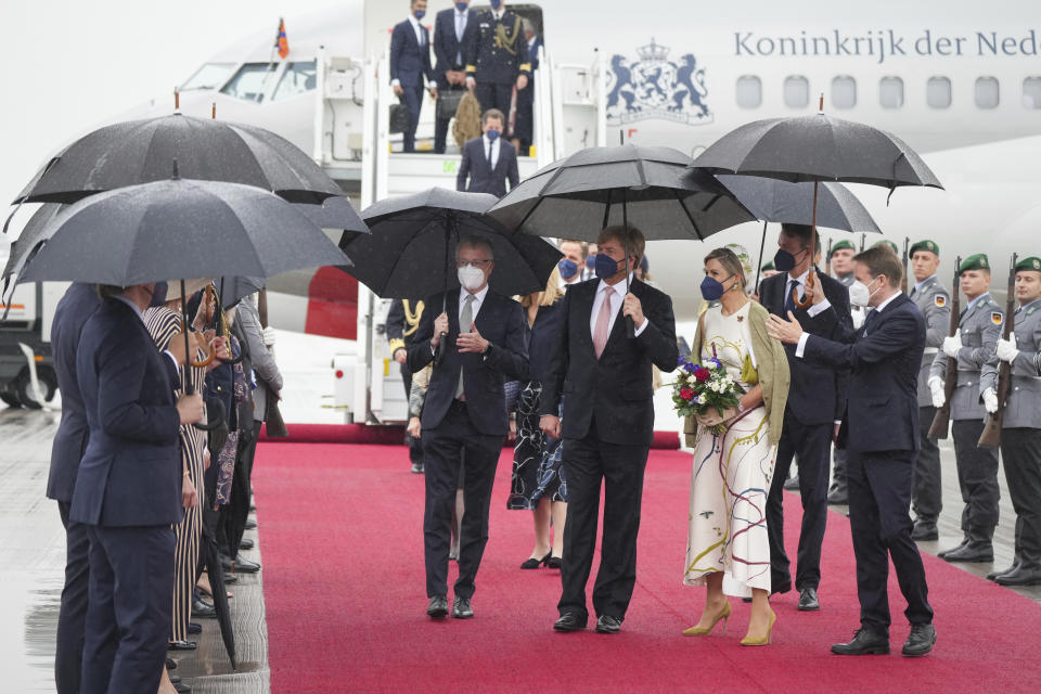 King Willem-Alexander of the Netherlands and Queen Maxima arrive at the Brandenburg Airport in Berlin, Germany, Monday, July 5, 2021. The Royals arrived in Germany for a three-day visit that was delayed from last year because of the coronavirus pandemic. (Kay Nietfeld/dpa via AP)