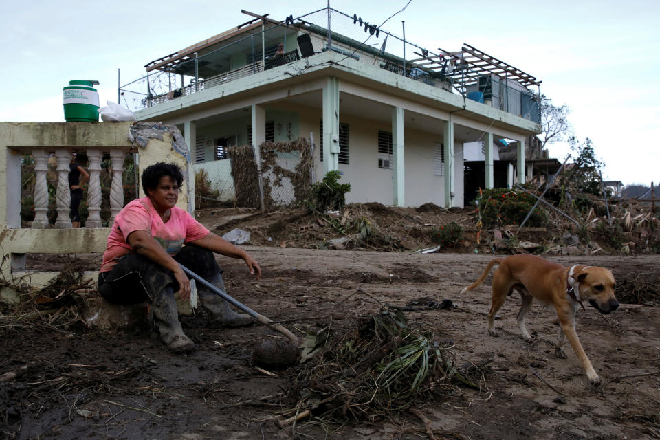 <p>Carmen Marrero takes a rest while she cleans debris from her house after the area was hit by Hurricane Maria in Toa Baja, Puerto Rico September 24, 2017. (Photo: Carlos Garcia Rawlins/Reuters) </p>