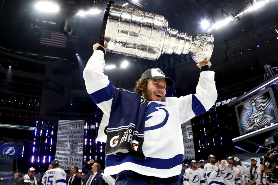 EDMONTON, ALBERTA - SEPTEMBER 28: Mikhail Sergachev #98 of the Tampa Bay Lightning hoists the Stanley Cup overhead after the  Tampa Bay Lightning defeated the Dallas Stars 2-0 in Game Six of the NHL Stanley Cup Final to win the best of seven game series 4-2 at Rogers Place on September 28, 2020 in Edmonton, Alberta, Canada. (Photo by Dave Sandford/NHLI via Getty Images)