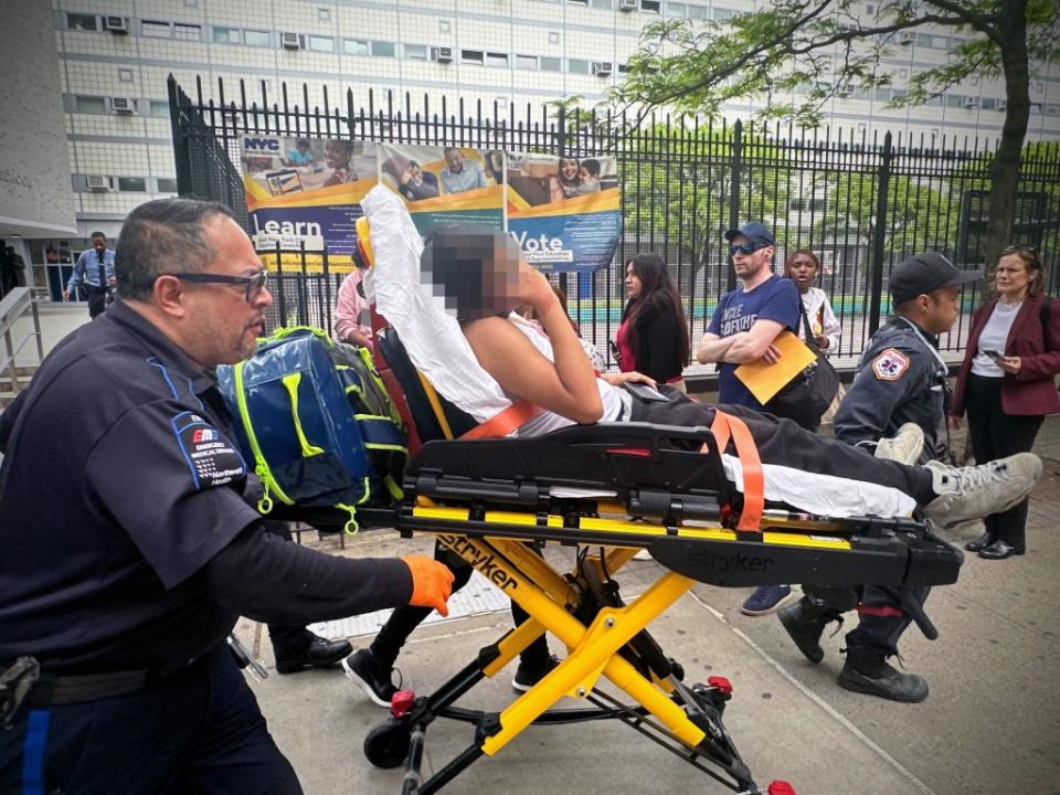 A victim getting brought to an ambulance after a stabbing at a school in Hell’s Kitchen on May 14, 2024. Phil O'Brien/W42ST.com