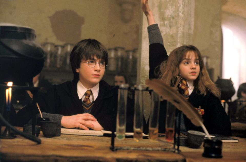 Daniel Radcliffe, left, and Emma Watson in a scene from "Harry Potter and the Sorcerer's Stone."