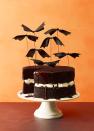 <p>Bewitching decorations take flight on a <a href="https://www.goodhousekeeping.com/food-recipes/dessert/a14316/chocolate-cake-recipe/" rel="nofollow noopener" target="_blank" data-ylk="slk:chocolate cake;elm:context_link;itc:0;sec:content-canvas" class="link ">chocolate cake</a>. Knot <a href="https://www.amazon.com/Offray-Berwick-Single-Satin-Ribbon/dp/B001DQ4L28/?tag=syn-yahoo-20&ascsubtag=%5Bartid%7C10055.g.1566%5Bsrc%7Cyahoo-us" rel="nofollow noopener" target="_blank" data-ylk="slk:black satin ribbon;elm:context_link;itc:0;sec:content-canvas" class="link ">black satin ribbon</a>, glue to <a href="https://www.amazon.com/Bendable-Sculpting-Jewelry-Artistic-Lubber/dp/B0982VLJTG/?tag=syn-yahoo-20&ascsubtag=%5Bartid%7C10055.g.1566%5Bsrc%7Cyahoo-us" rel="nofollow noopener" target="_blank" data-ylk="slk:floral wire;elm:context_link;itc:0;sec:content-canvas" class="link ">floral wire</a>, and dot on eyes with puff paint.</p><p><a class="link " href="https://www.amazon.com/Offray-Berwick-Single-Satin-Ribbon/dp/B001DQ4L28/?tag=syn-yahoo-20&ascsubtag=%5Bartid%7C10055.g.1566%5Bsrc%7Cyahoo-us" rel="nofollow noopener" target="_blank" data-ylk="slk:SHOP BLACK RIBBON;elm:context_link;itc:0;sec:content-canvas">SHOP BLACK RIBBON</a><br> </p>