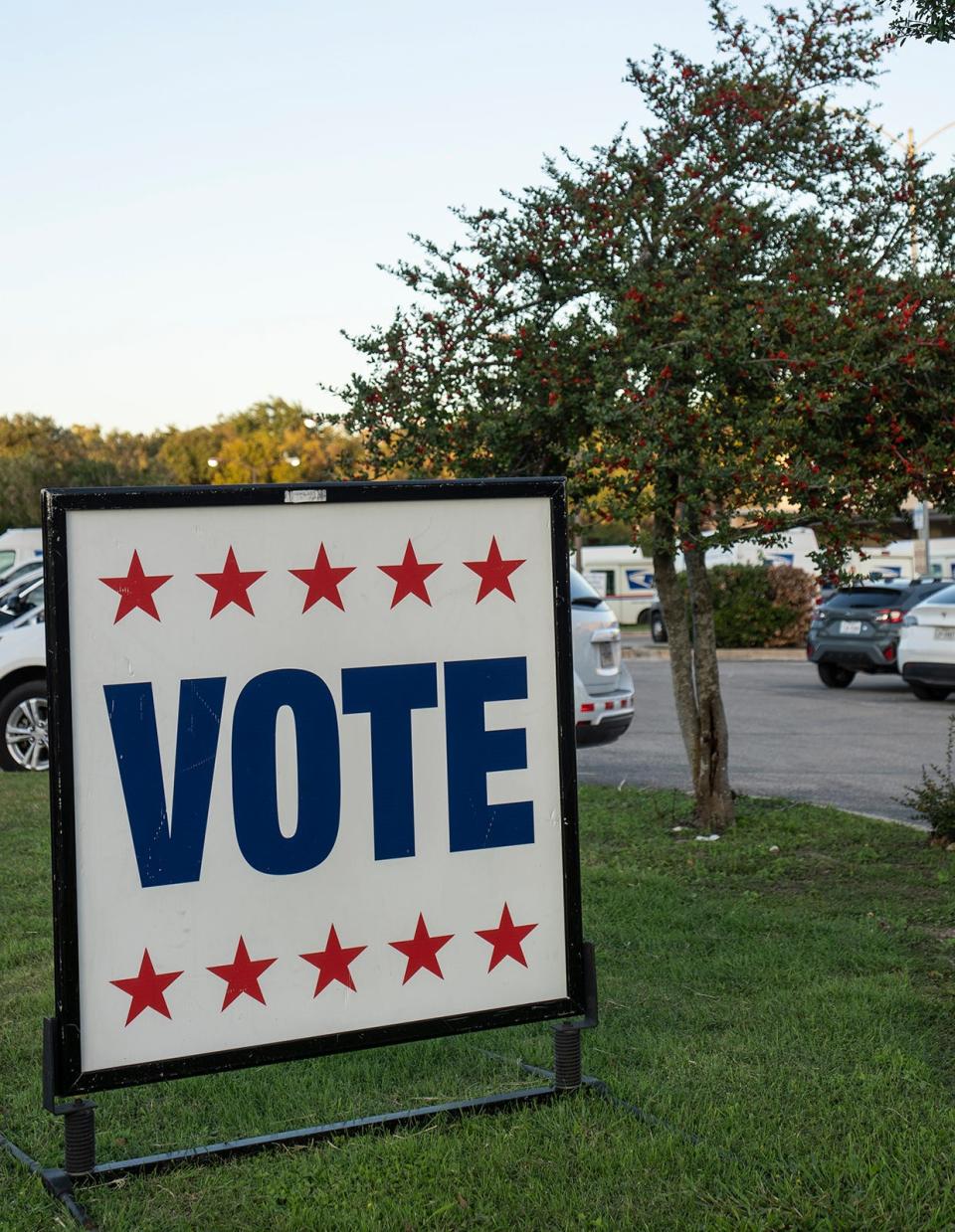 Signs urge people to vote outside the Old Quarry Branch Library on Tuesday.