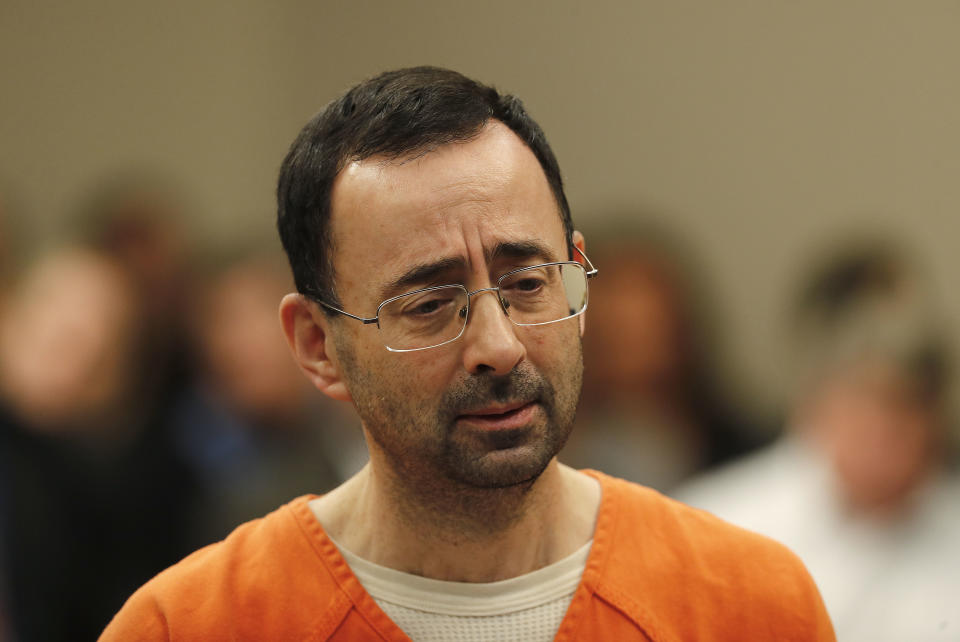 Dr. Larry Nassar was sentenced to the maximum 60-year sentence on Thursday in his federal child pornography case. Dozens of women have also accused him of sexual assault. (AP)