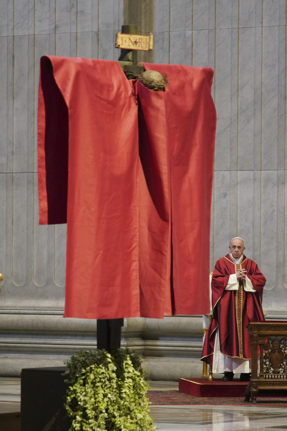 Pope Francis presides over a Mass for the Passion of Christ, at St. Peter's Basilica, at the Vatican, Friday, April 10, 2020. The new coronavirus causes mild or moderate symptoms for most people, but for some, especially older adults and people with existing health problems, it can cause more severe illness or death. (AP Photo/Andrew Medichini, Pool)