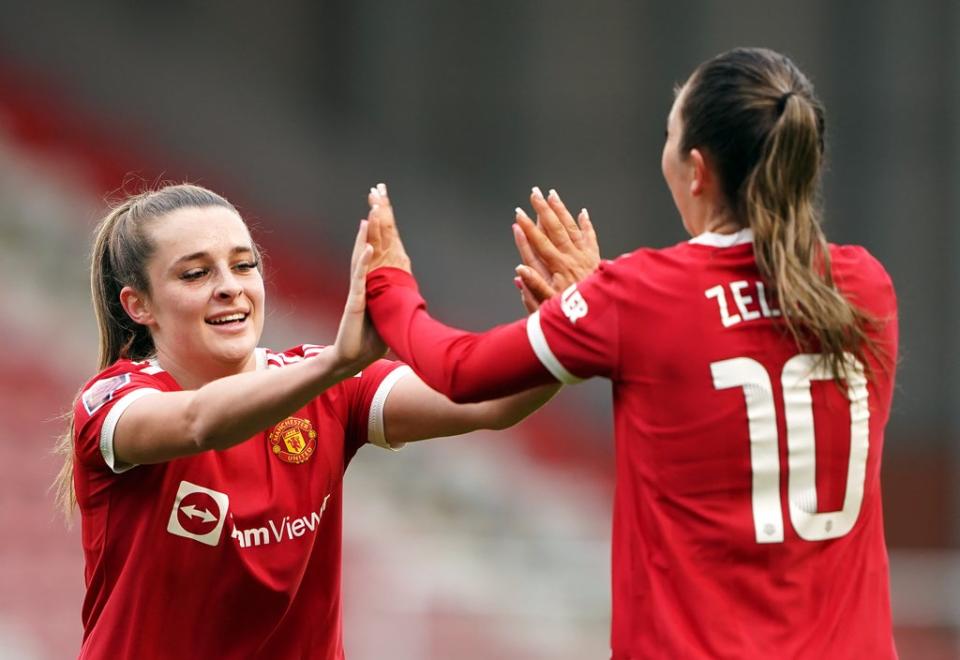 Manchester United’s Ella Toone (left) and Katie Zelem celebrate their side’s first goal of the game (Zac Goodwin/PA) (PA Wire)