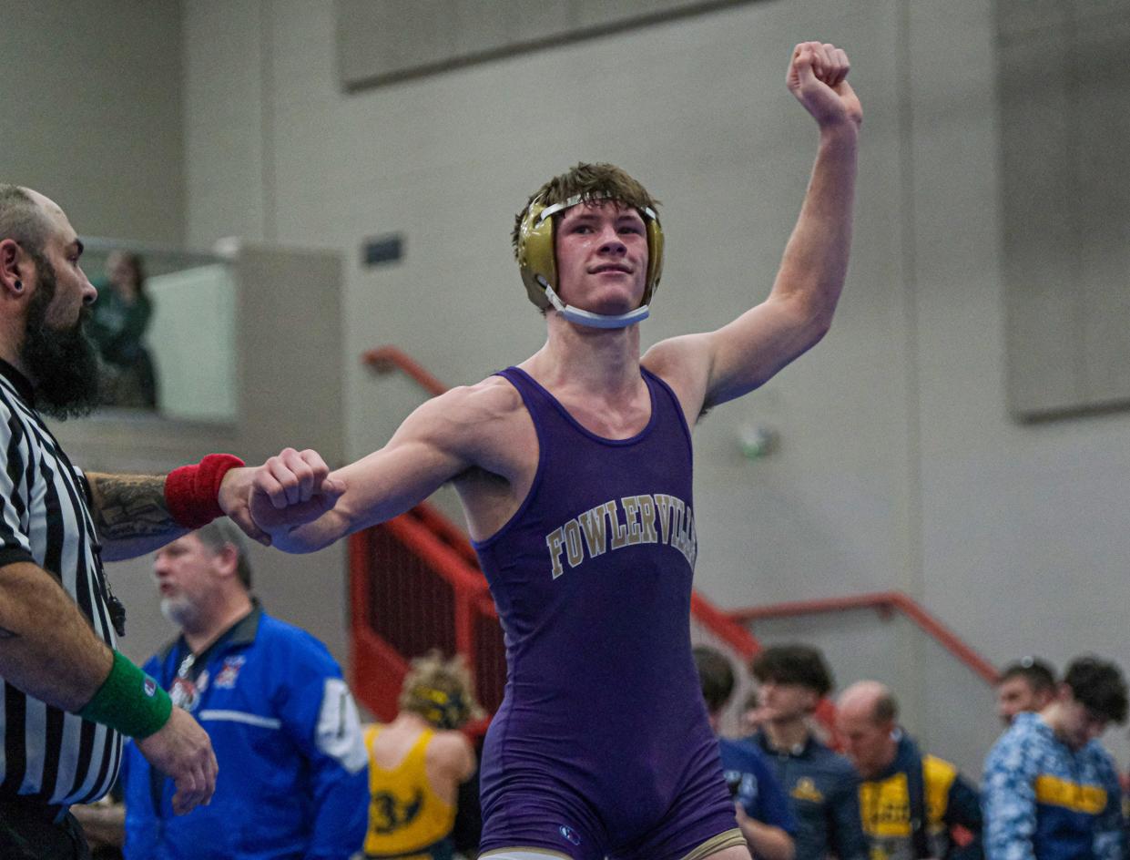 Brock Foster from Fowlerville celebrates his 157 weight class win over Gavin VanKirk from Mason at the CAAC Wrestling Championships Saturday, Feb. 3, 2024.