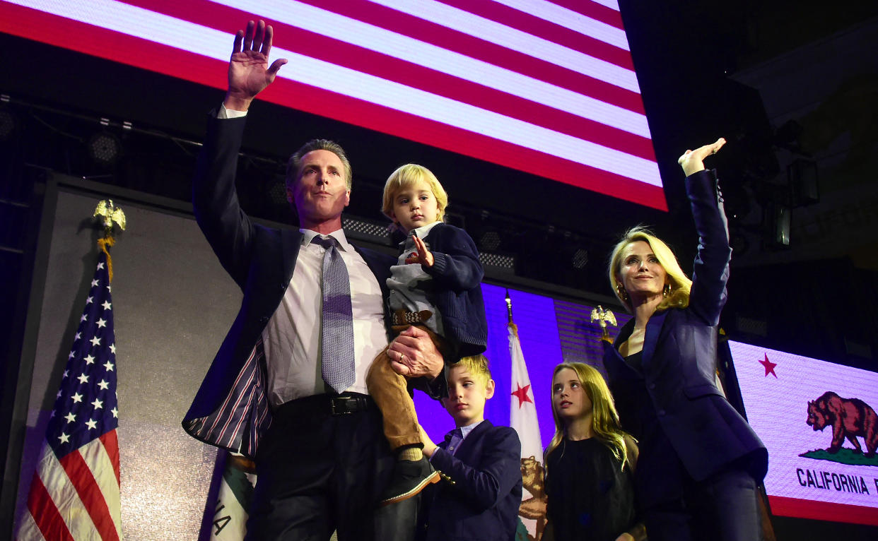  California's Democratic gubernatorial candidate Gavin Newsom and his family waves to supporters from stage at his election night watch party in Los Angeles, California on November 6, 2018.