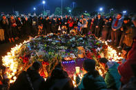 <p>Mourners pay their respects during a vigil held in memory of murdered Melbourne comedian, 22-year-old Eurydice Dixon, at Princess Park in Melbourne, Australia. Dixon was murdered as she walked home through Princes Park on Wednesday following a comedy performance in the city. (Michael Dodge/Getty Images) </p>
