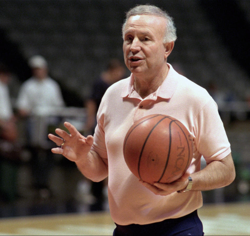 FILE - In this Oct. 17, 1995 file photo, Illinois men's basketball coach Lou Henson gives directions to his team during practice after the team's media day in Champaign, Ill. Henson, the basketball coach who led Illinois back into the national spotlight, has died at age 88. The school said Henson died Saturday, July, 25, 2020, and was buried on Wednesday, July 29, 2020. .(AP Photo/Mark Cowan, File)