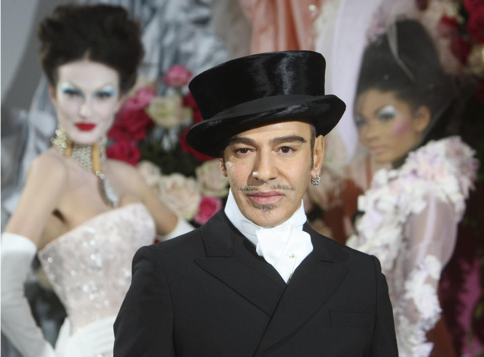 FILE - In this Jan. 25, 2010 file photo, fashion designer John Galliano poses at the end of the presentation of the Dior Haute Couture spring/summer 2010 fashion collection in Paris. Parsons The New School of Design in New York City said in a statement Wednesday May 8, 2013 it has canceled a four-day workshop by the controversial fashion designer because the two sides can't reach consensus on the conditions of the workshop. (AP Photo/Jacques Brinon, file)