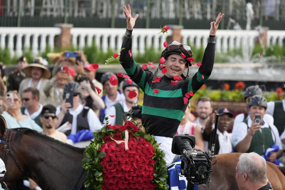 Brian Hernandez Jr. celebrates in the winner's circle after riding Mystik Dan to win the 150th running of the Kentucky Derby horse race at Churchill Downs Saturday, May 4, 2024, in Louisville, Ky. (AP Photo/Jeff Roberson)