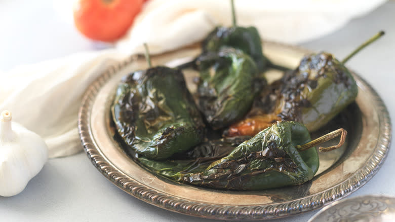 charred poblano pepper in a silver bowl