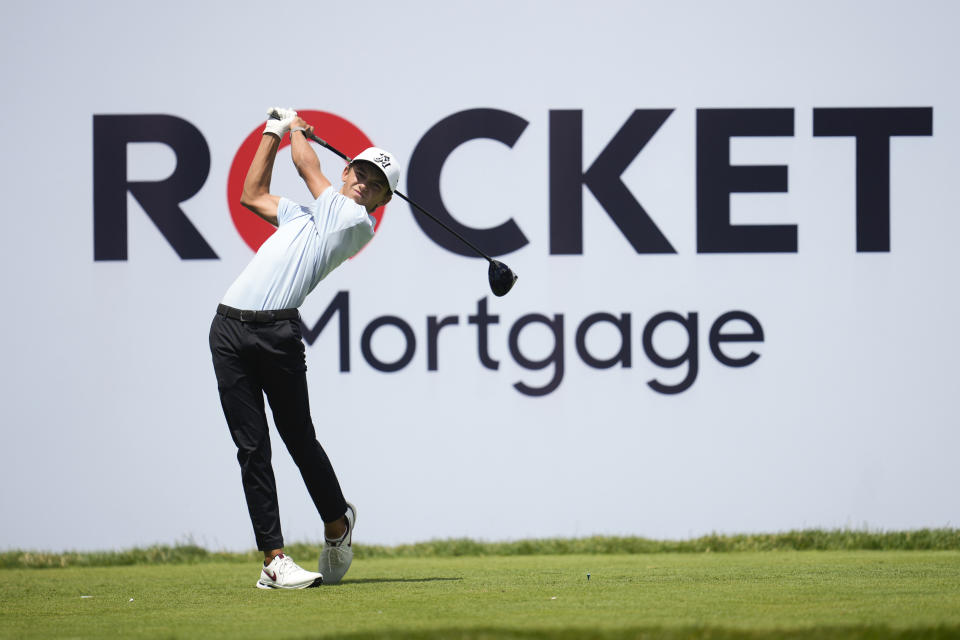 Miles Russell hits off the 10th tee during the first round of the Rocket Mortgage Classic golf tournament at Detroit Country Club, Thursday, June 27, 2024, in Detroit. (AP Photo/Paul Sancya)