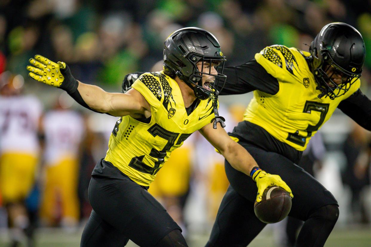 Oregon defensive back Evan Williams celebrates a fumble recovery as the No. 6 Oregon Ducks host the USC Trojans Nov. 11 at Autzen Stadium in Eugene.