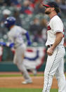 Cleveland Indians starting pitcher Logan Allen, right, waits for Kansas City Royals Whit Merrifield to run the bases after Merrifield hit a two-run home run in the second inning of a baseball game, Monday, April 5, 2021, in Cleveland. (AP Photo/Tony Dejak)