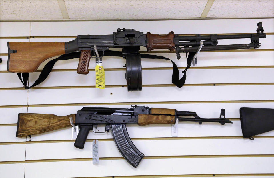 FILE - Assault weapons are seen for sale at Capitol City Arms Supply on Jan. 16, 2013 in Springfield, Ill. Legal challenges to Illinois' semiautomatic weapons ban began Wednesday, Jan. 18, 2023, with a federal complaint that the eight-day-old law prohibits “commonly possessed” and constitutionally protected guns and a state court pleading questioning the law's exemptions based on a person's employment. (AP Photo/Seth Perlman, File)