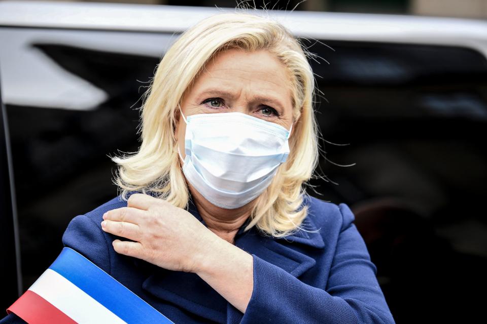 French far-right party Rassemblement National's (RN) deputy Marine Le Pen arrives to lay a wreath at the Jeanne d'arc statue on May 1, 2020, in Paris on the 46th day of a strict lockdown in France to stop the spread of COVID-19 (novel coronavirus). (Photo by Alain JOCARD / AFP) (Photo by ALAIN JOCARD/AFP via Getty Images)