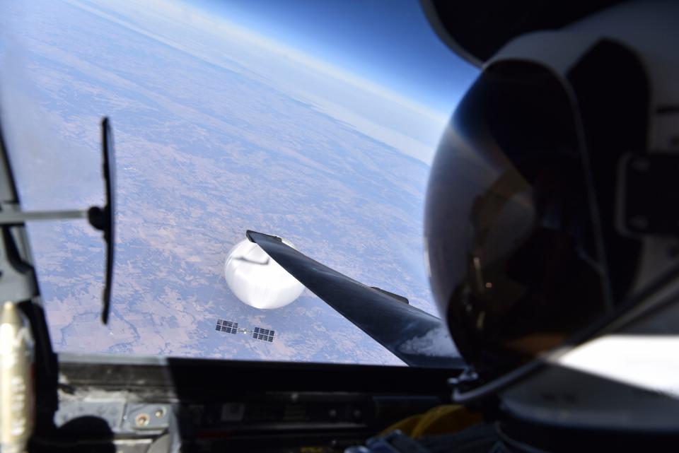 A US Air Force pilot looked down at the suspected Chinese surveillance balloon as it hovered over the Central Continental United States February 3, 2023. Recovery efforts began shortly after the balloon was downed.