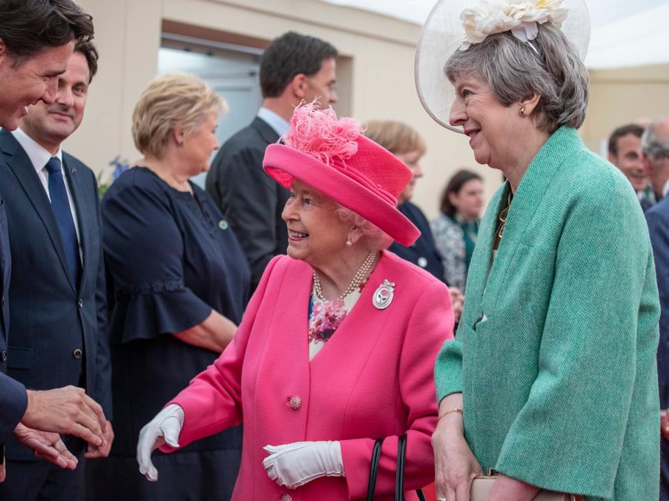 With Canadian PM Justin Trudeau and former British PM Theresa May at an event commemorating the 75th anniversary of the D-Day landings (PA)