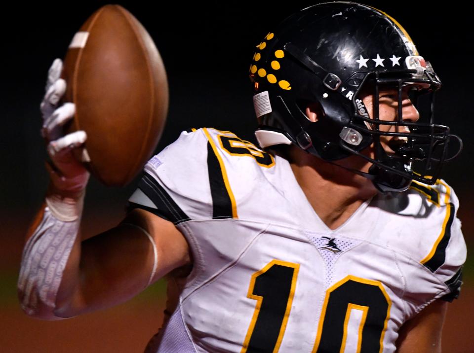 Dawson Hearne holds up the football after scoring Cisco's second touchdown against Jim Ned last season in Tuscola.