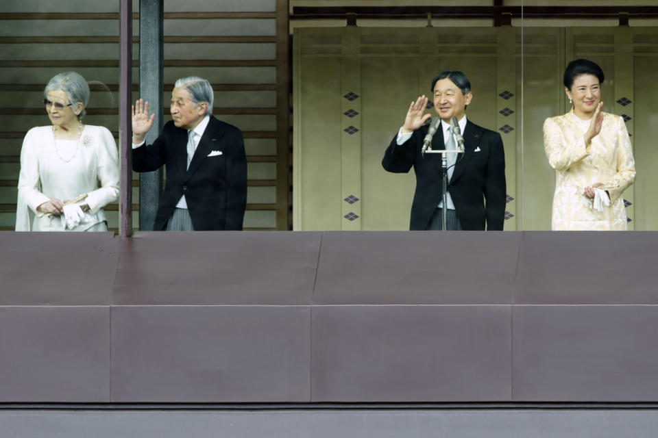 Japan's Emperor Naruhito, second from right, waves with Empress Masako, right, Empress Emerita Michiko and Emperor Emeritus Akihito to well-wishers from the bullet-proofed balcony during a public appearance with his imperial families at Imperial Palace in Tokyo Thursday, Jan. 2, 2020, in Tokyo. (AP Photo/Eugene Hoshiko)
