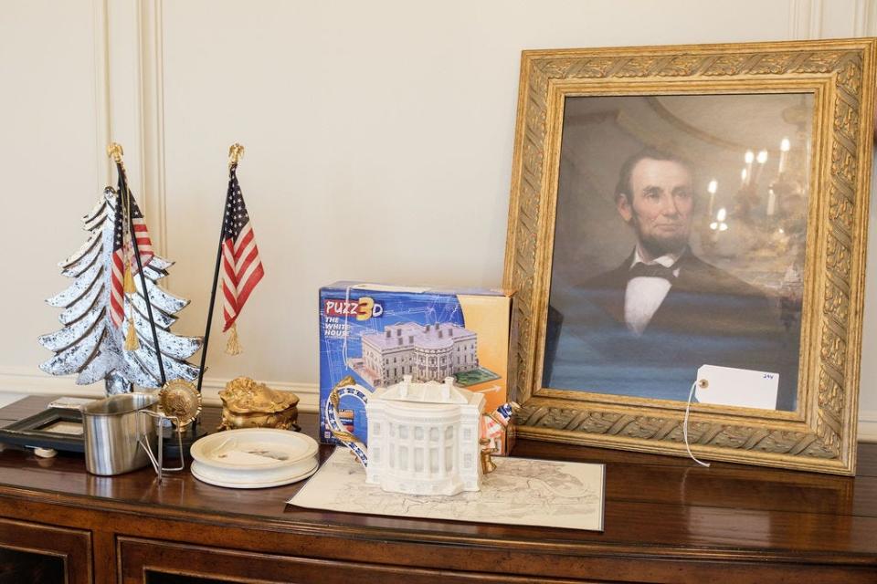 An Abraham Lincoln print, along with a White House-shaped teapot and puzzle, are included in this lot of items from Villa Collina. An online auction of items from Knoxville's largest home will take place Dec. 4 before the home eventually is demolished and replaced with three smaller homes.