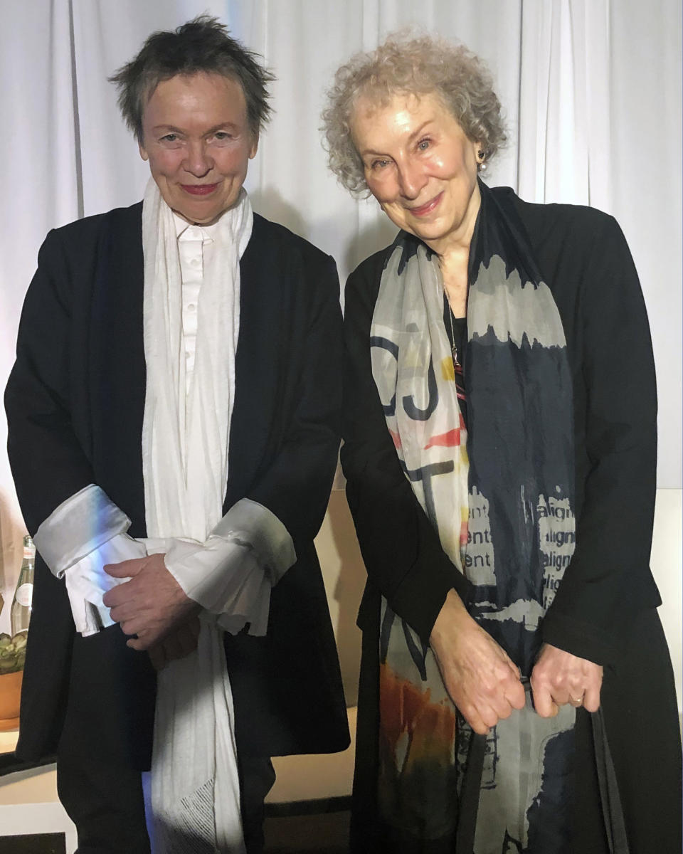 American avant-garde artist, composer, musician and film director Laurie Anderson, left, and Canadian author Margaret Atwood pose for photographs before speaking together at an event sponsored by the MacDowell Colony, Monday, Dec. 9, 2019, in New York. (AP Photo/Hillel Italie)