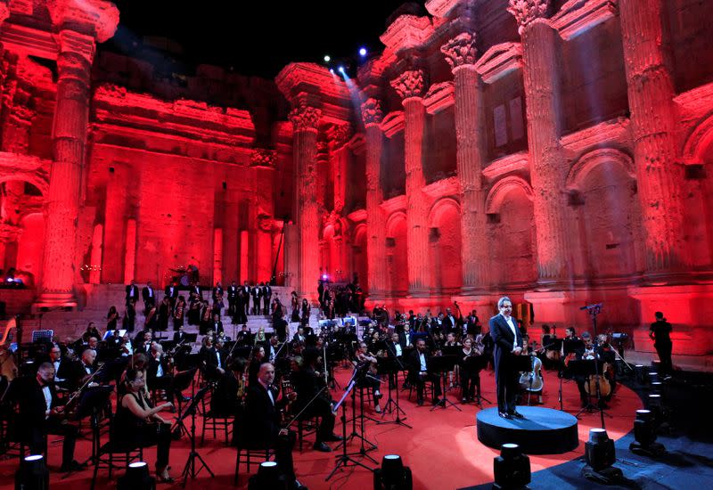 Lebanese maestro Harout Fazlian stands on stage before the start of "Sound of Resilience" concert of the Baalbeck music festival