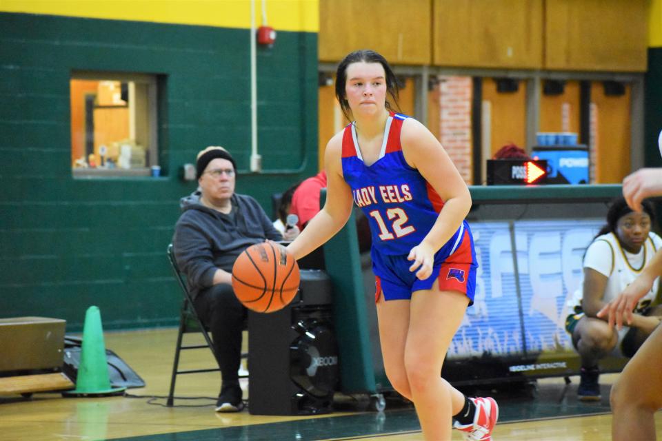 Eminence's Danica Myers looks for a lane to drive inside during the Eels' matchup with Crispus Attucks on Dec. 15, 2022.