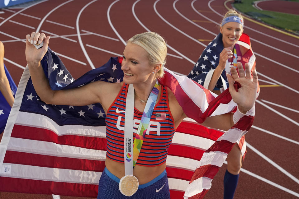 Gold medalist Katie Nageotte, of the United States, poses with silver medalist Sandi Morris, of the United States, left, after the women's pole vault final at the World Athletics Championships on Sunday, July 17, 2022, in Eugene, Ore. (AP Photo/Charlie Riedel)