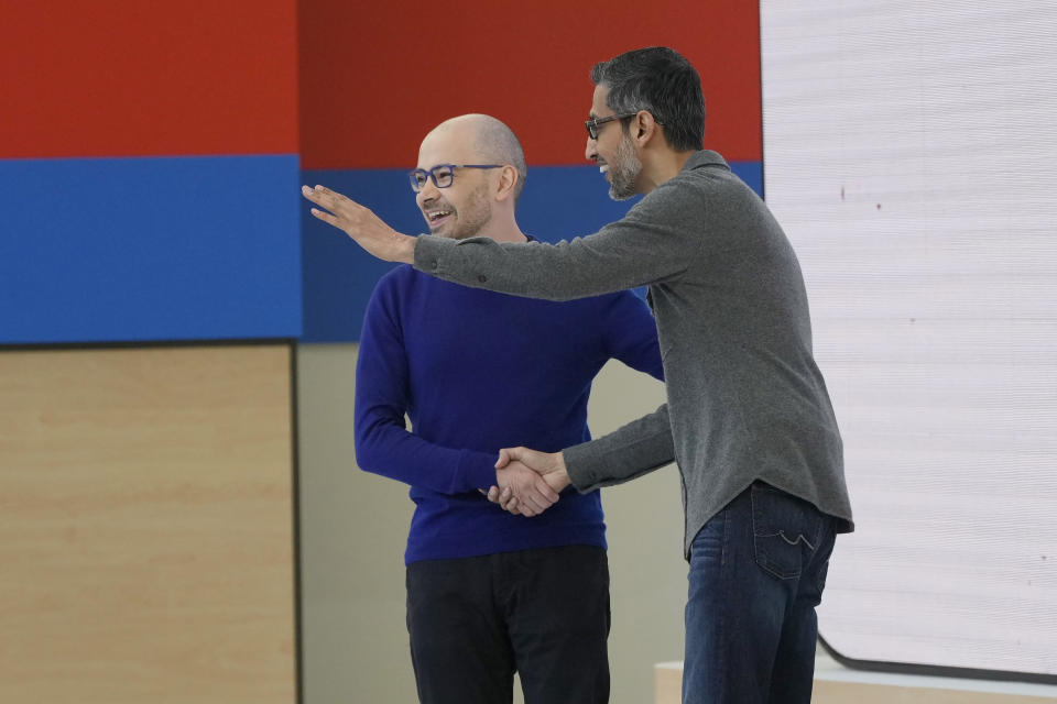 Demis Hassabis, CEO of DeepMind Technologies, left, shakes hands with Alphabet CEO Sundar Pichai at a Google I/O event in Mountain View, Calif., Tuesday, May 14, 2024. (AP Photo/Jeff Chiu)