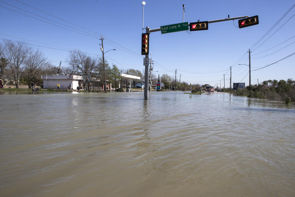 High water from a water main break floods Clinton Drive just east of the East Loop 610 on Thursday, Feb. 27, 2020 in Houston. The flooding closed the major freeway that circles the city. ( Brett Coomer/Houston Chronicle via AP)