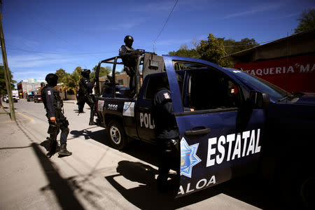 State police patrol ahead of the visit of Mexico's President Andres Manuel Lopez Obrador to Badiraguato, in the Mexican state of Sinaloa, Mexico February 15, 2019. REUTERS/Daniel Becerril