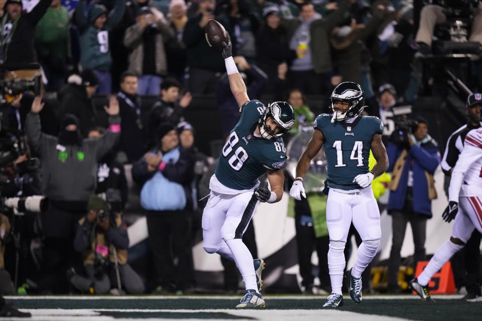 Philadelphia Eagles tight end Dallas Goedert (88) celebrates his touchdown catch as teammate Kenneth Gainwell (14) looks on during the first half of an NFL divisional round playoff football game against the New York Giants, Saturday, Jan. 21, 2023, in Philadelphia. (AP Photo/Matt Slocum)
