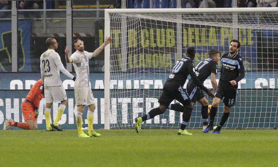 Lazio's Ciro Immobile, second from right, celebrates after scoring his side's opening goal during an Italian Cup quarterfinal soccer match between Inter Milan and Lazio at the San Siro stadium, in Milan, Italy, Thursday, Jan. 31, 2019. (AP Photo/Luca Bruno)