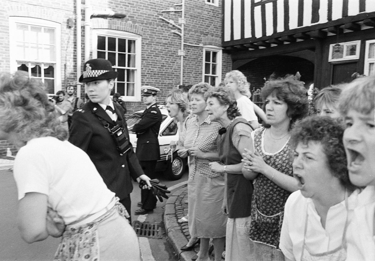 Colin Pitchfork arrives at court, charged with the rape and murder of two Leicestershire schoolgirls, he is greeted by jeers from local factory workers, Leicester Magistrates Court, Monday 21st September 1987.