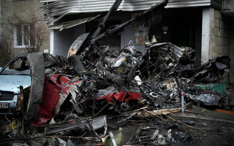 A view of the scene where a helicopter crashed on civil infrastructure in Brovary, on the outskirts of Kyiv - Daniel Cole/AP